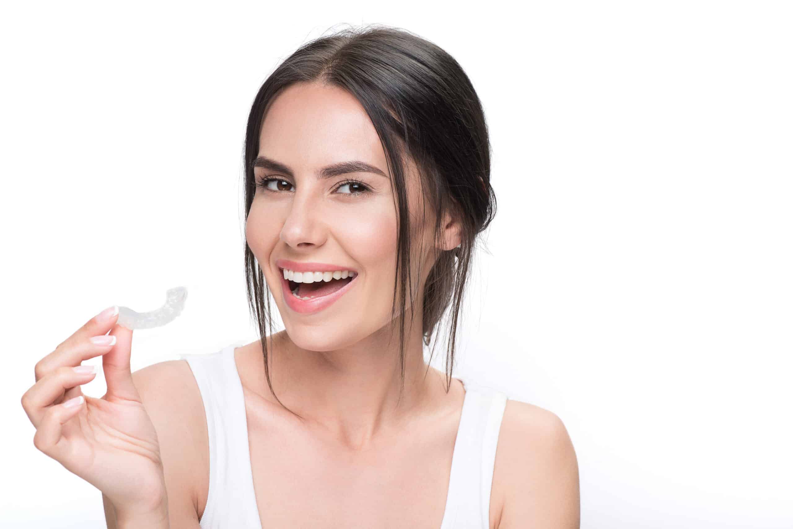 Cheerful,Young,Woman,Showing,Clear,Aligner